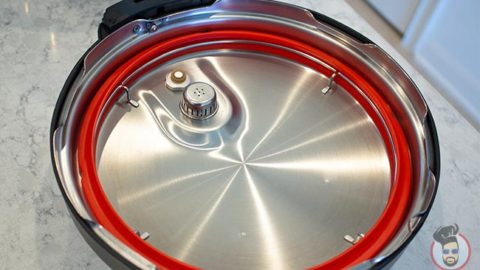 an instant pot lid on a counter with a red sealing ring