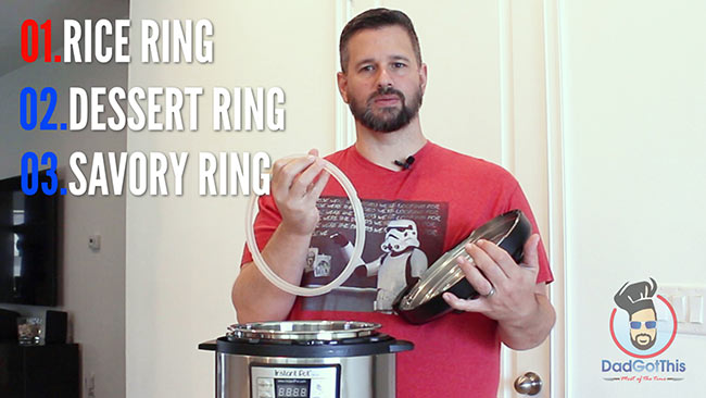 Dad holding the sealing ring from the instant pot.