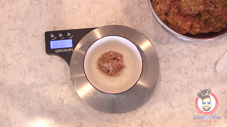 meatball mixture being weighed on a kitchen scale
