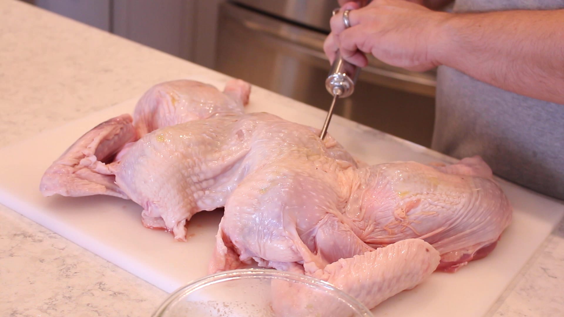 injecting a spatchcocked turkey