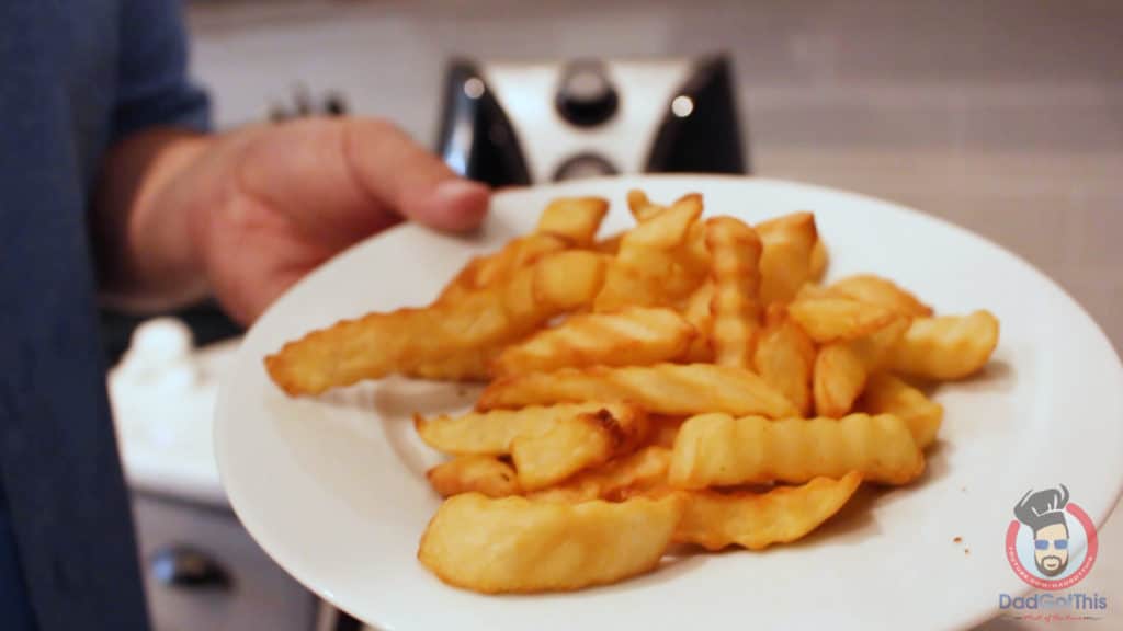 french fries done on a white plate