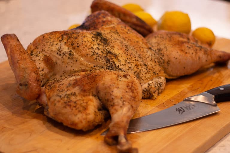A spatchcocked Roast turkey on a cutting board