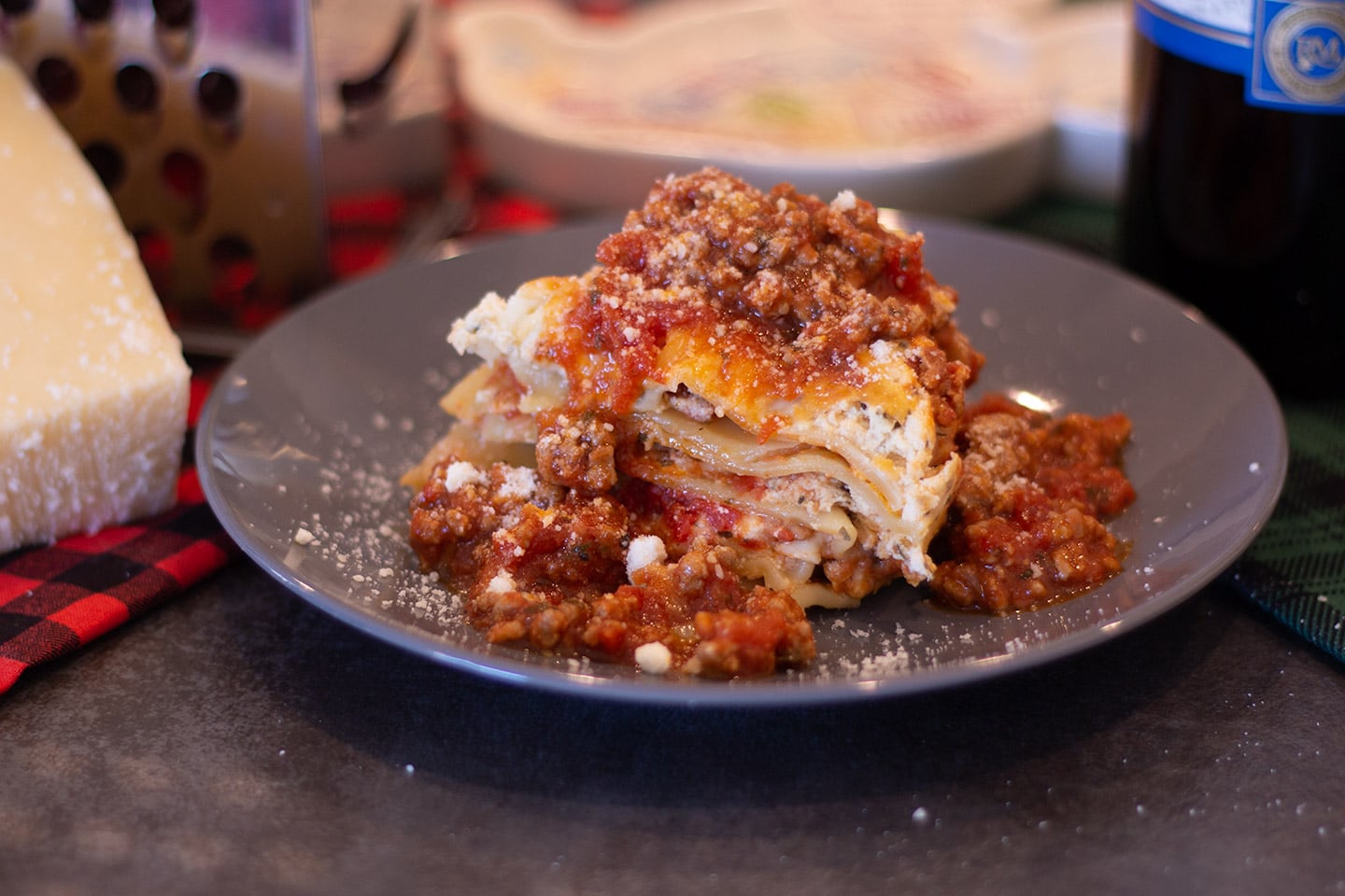 Lasagna with meat sauce on a grey plate