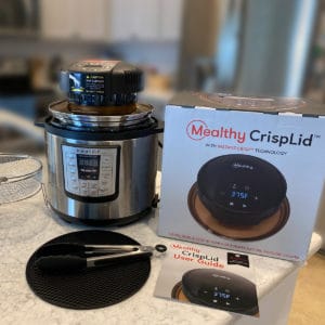 Mealthy Crisplid and accessories on a counter with an instant pot