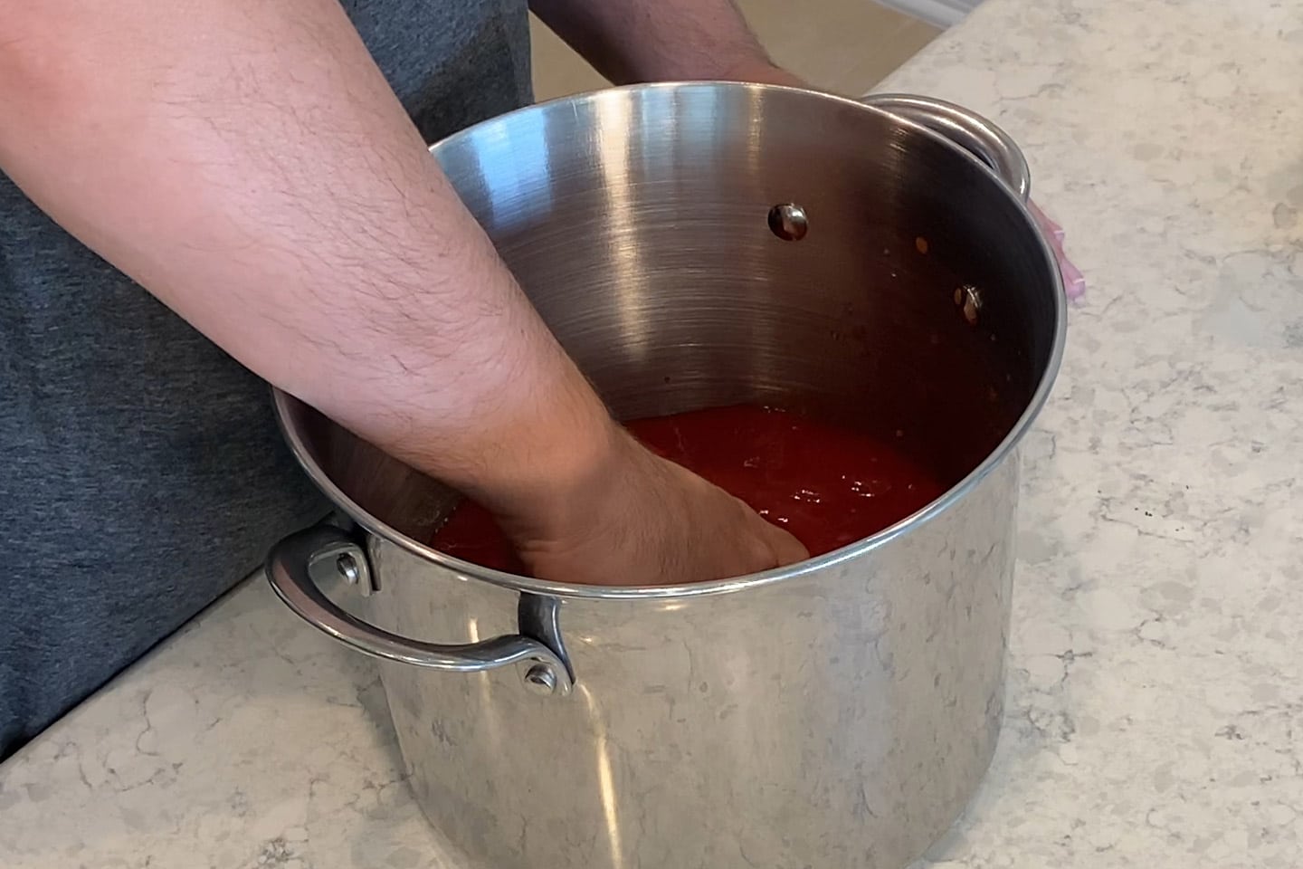 crushing the tomatoes