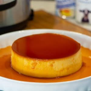 a leche flan in a plate on a counter