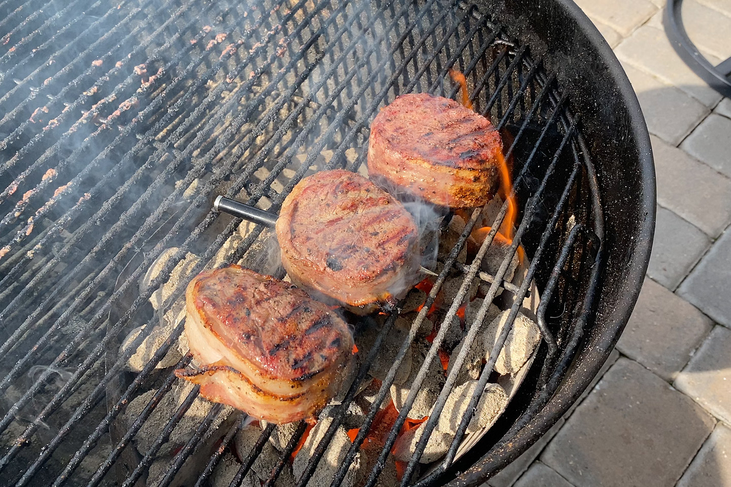 bacon wrapped filets on a grill
