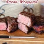 bacon wrapped filets on a cutting board