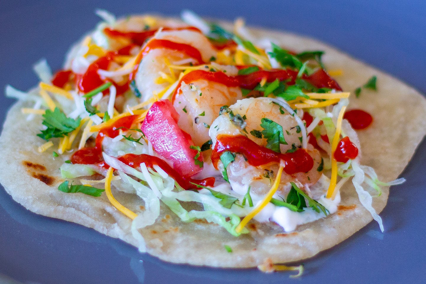 Dad's easy shrimp taco recipe assembled on a plate