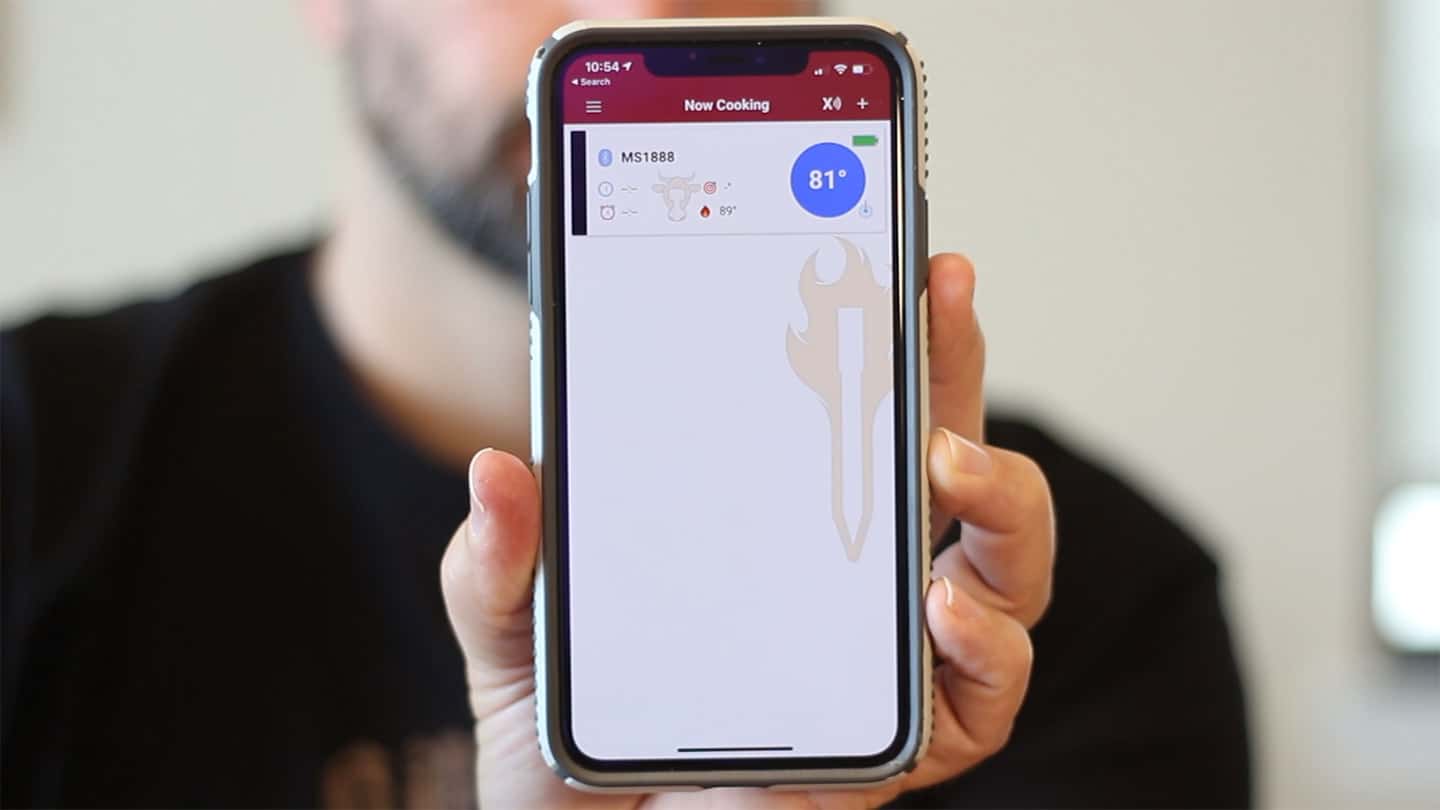 An iphone being held up showing the meatstick app