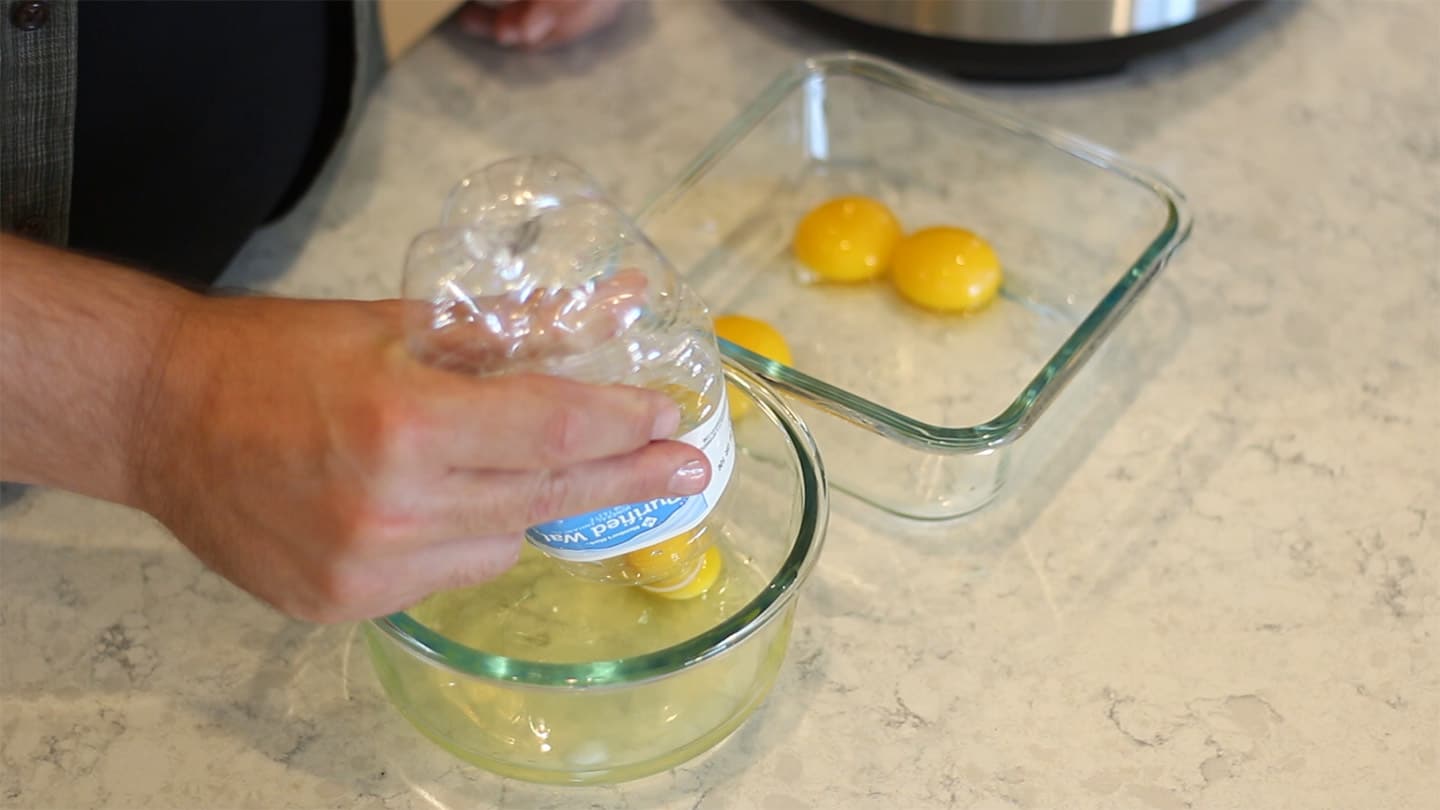 using a water bottle to separate egg yolks