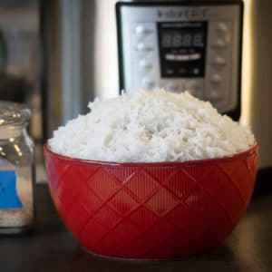 Basmati Rice in front of an Instant Pot in a red bowl