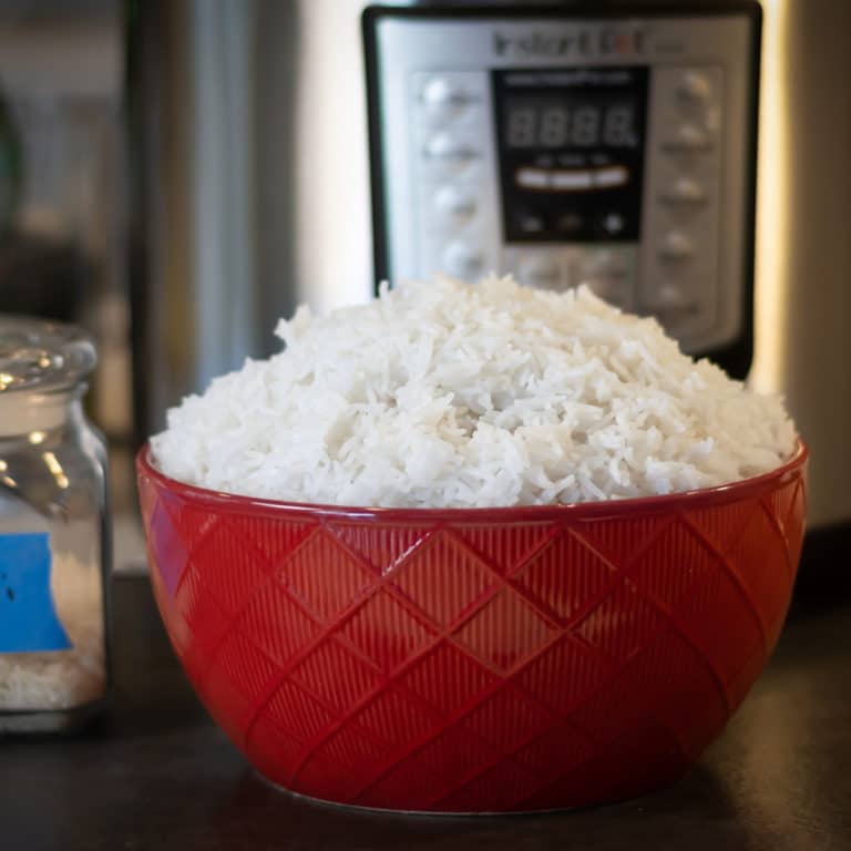 Basmati Rice in front of an Instant Pot in a red bowl