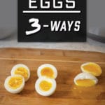 3 boiled eggs cut open on a cutting board