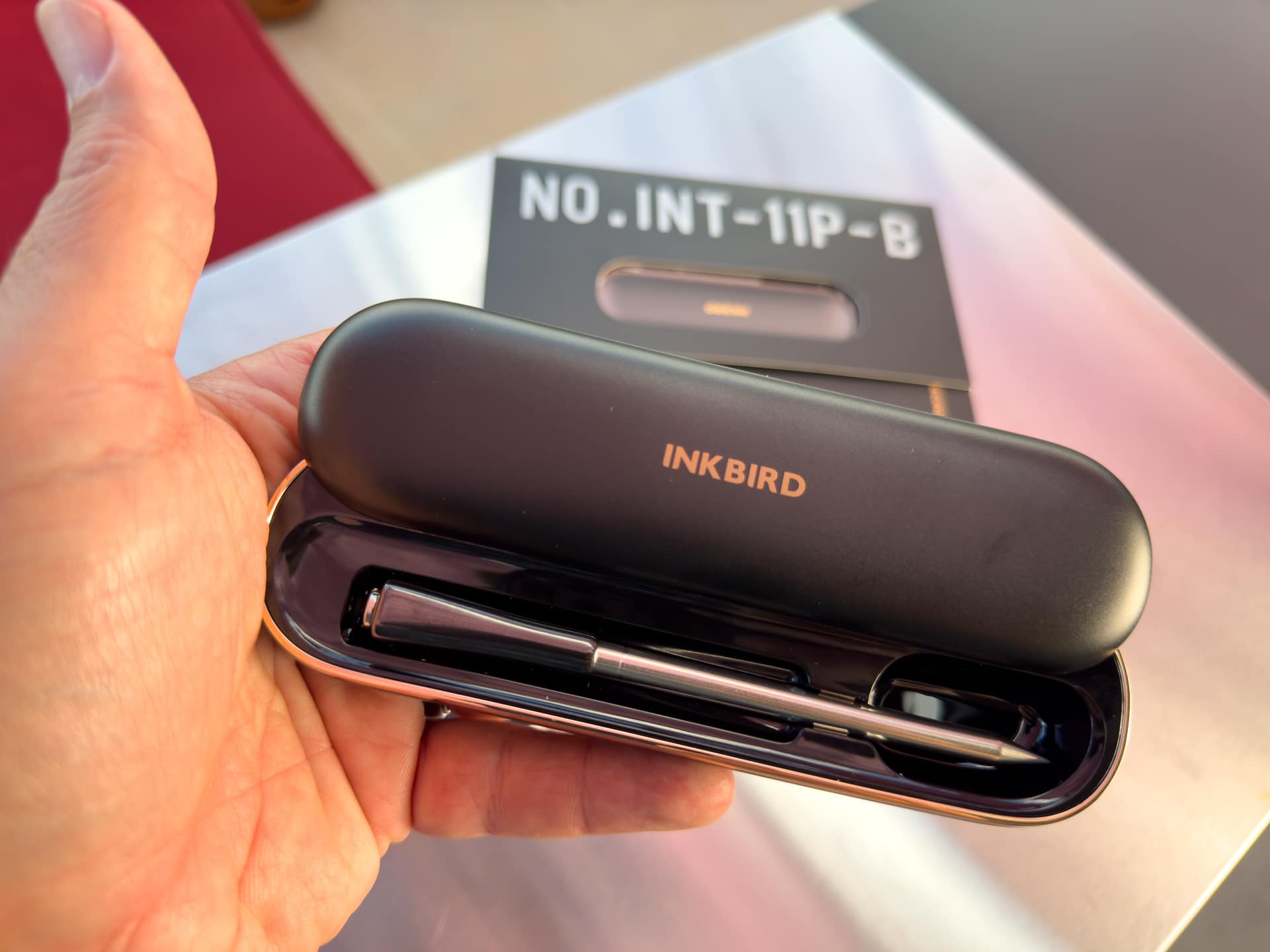The INKBIRD INT-11P-B Wireless Thermometer probe inside its charging case.