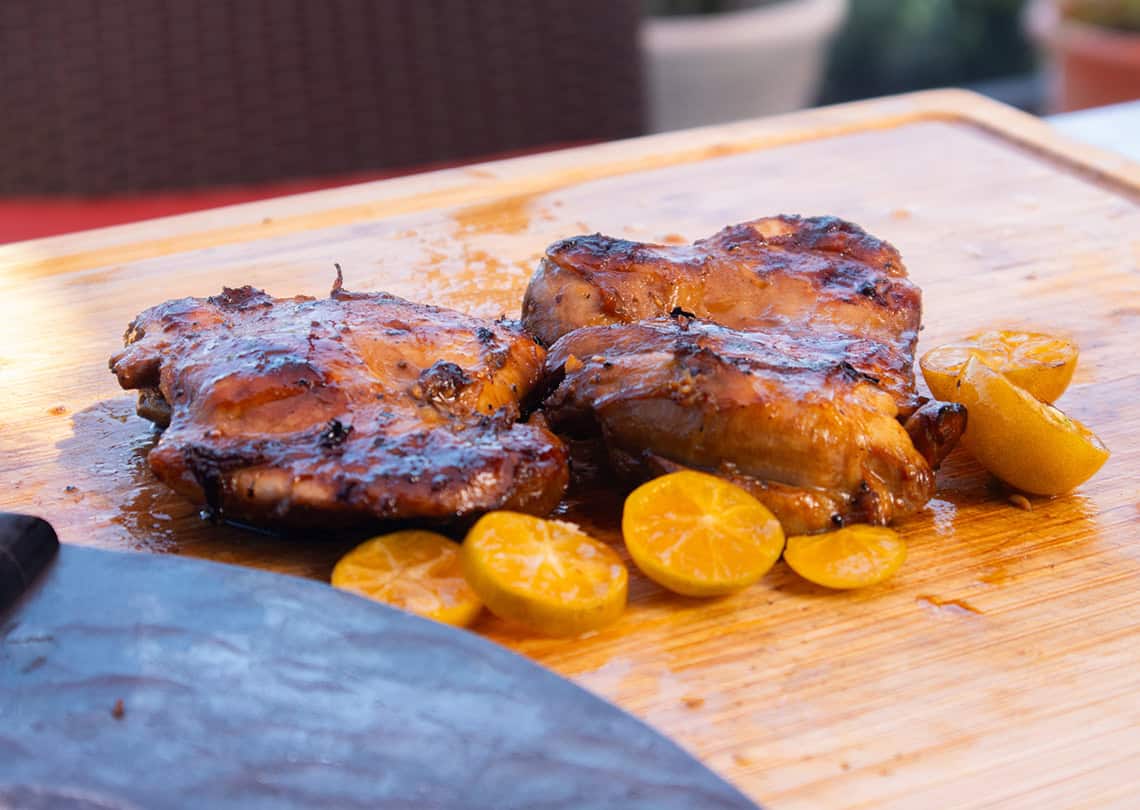 ninja woodfire chicken thighs on a cutting board