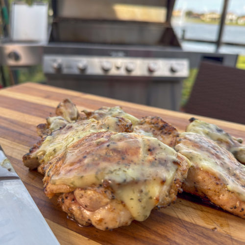 Grilled Chicken Thighs with Lemon Garlic Parsley Sauce.