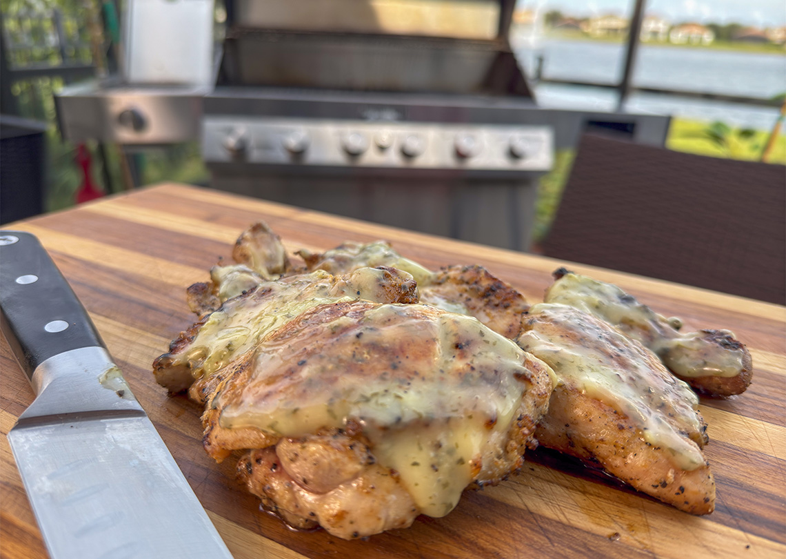 Grilled Chicken Thighs with Lemon Garlic Parsley Sauce.