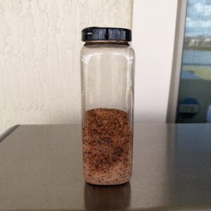 Dad Rub 1.3 Salt Free BBQ Rub in a clear spice shaker