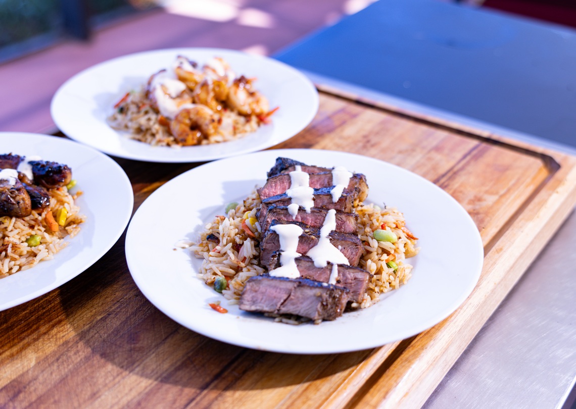 Hibachi Style Fried Rice with teriyaki steak, chicken and shrimp
